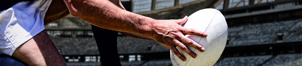 Competitive rugby match scene emphasizing athletic performance, teamwork, and game strategy.